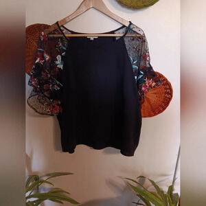 Umgee top with floral sleeves Color: Black and different